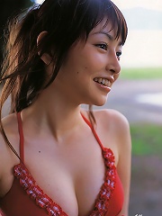 Sizzling hot gravure idol babe with soft plump boobs in a bikini